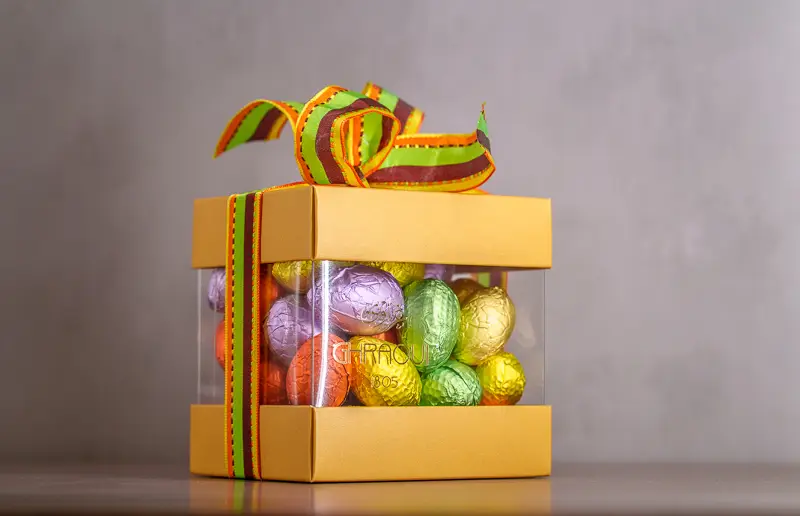 easter campaign chocolate photography big box of chocolate in pink, for easter. ghraoui chocolate bombons in duck and egg shape.