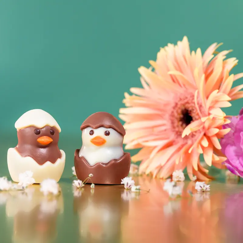 easter campaign chocolate photography big box of chocolate in pink, for easter. ghraoui chocolate bombons in duck and egg shape.